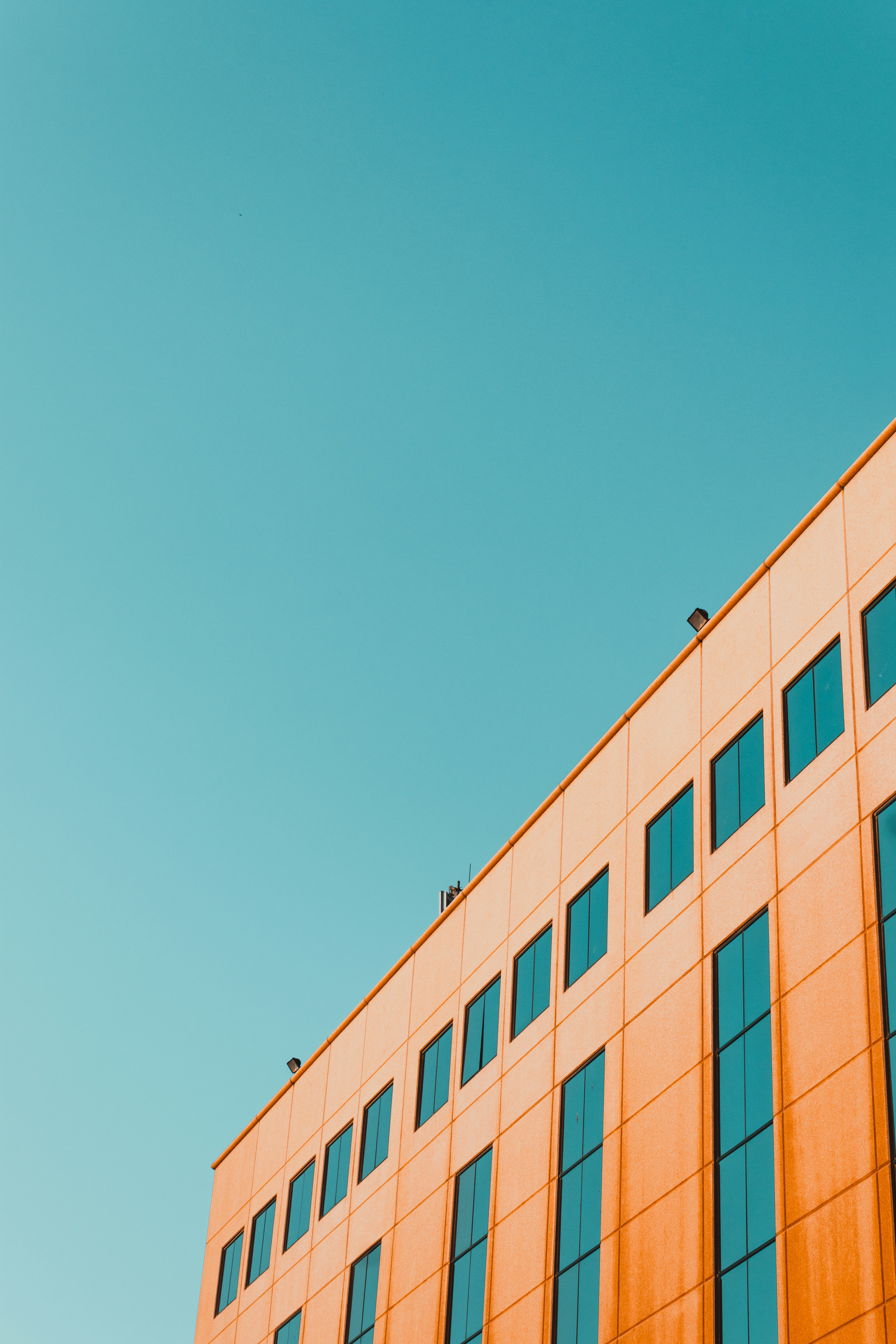 brown concrete building under blue sky during daytime